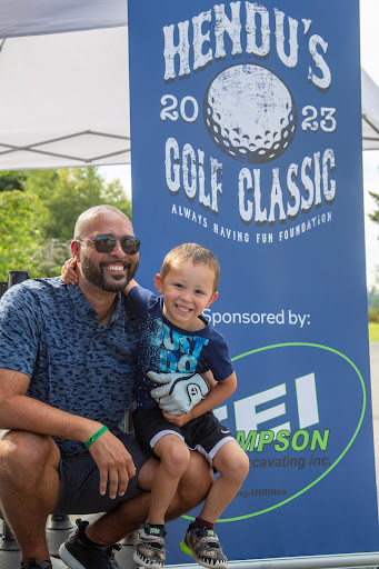 Trent Henderson with his son at Hendu's Golf Classic